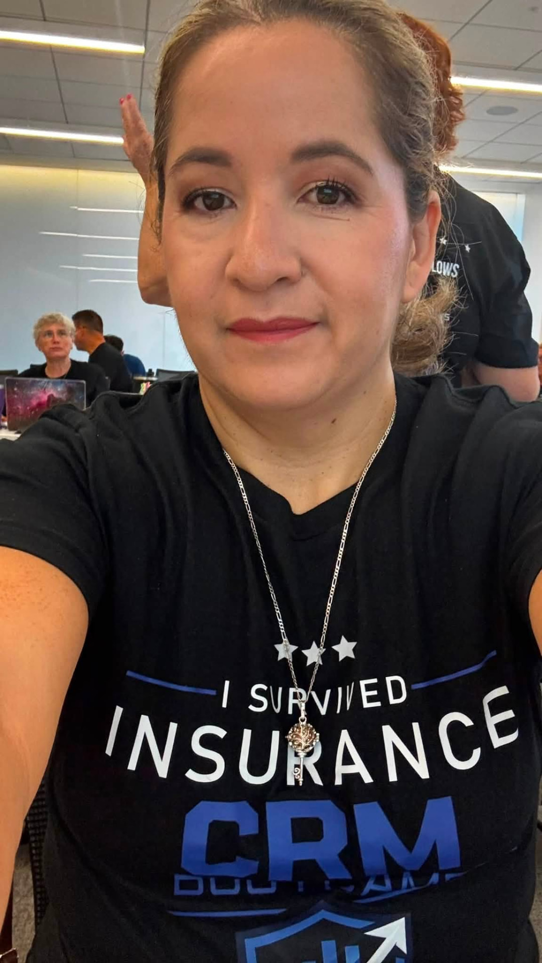 Attendee wearing her bootcamp shirt during a session